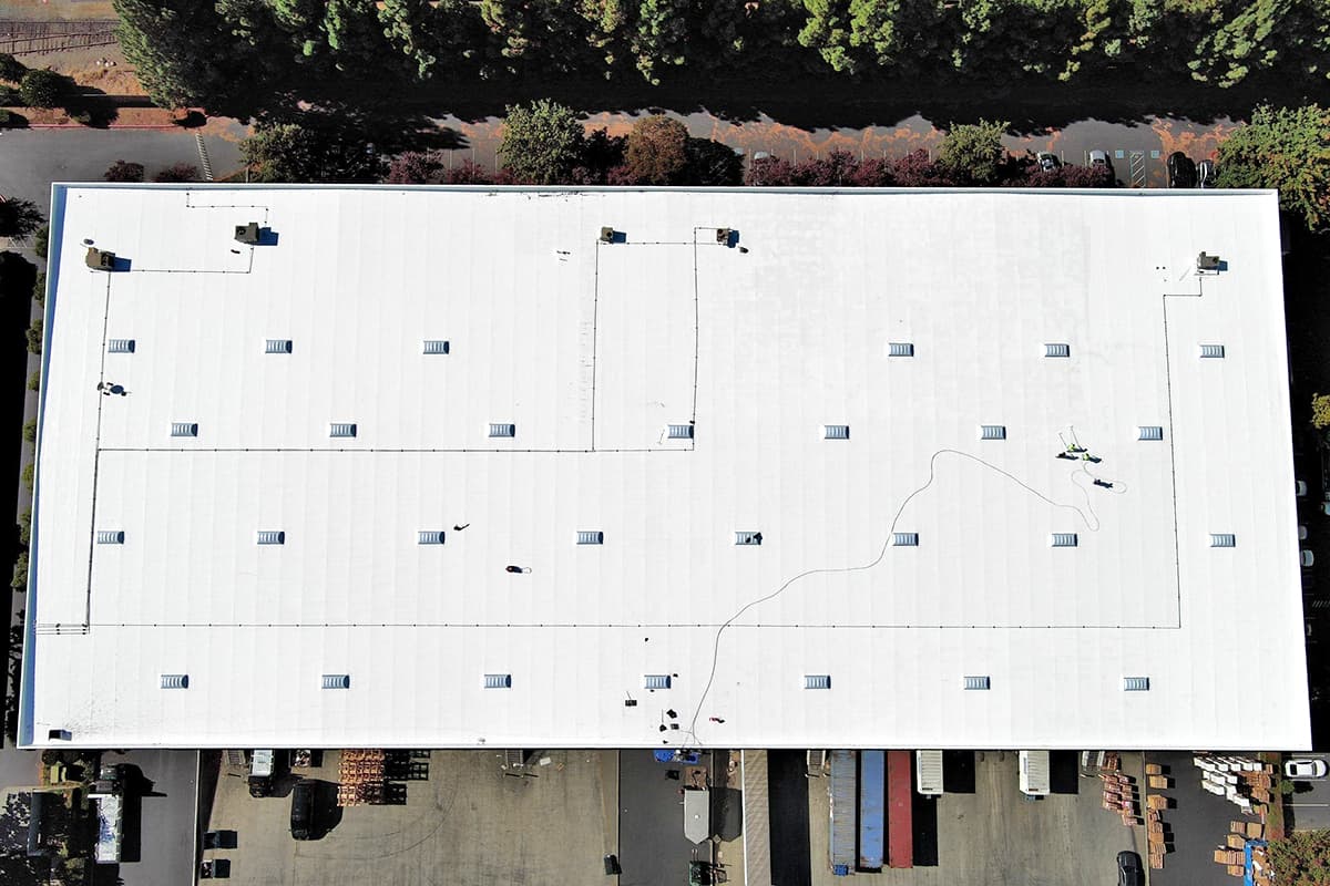 Aerial view of a new commercial roof system application